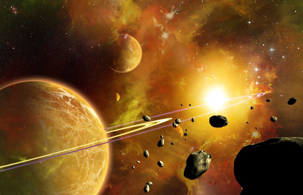 A ringed golden planet and a drifting asteroid field lit by a nearby star