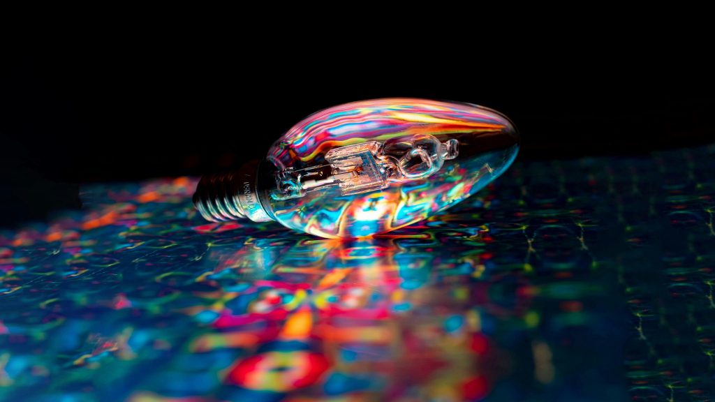 iridescent hued lightbulb on its side